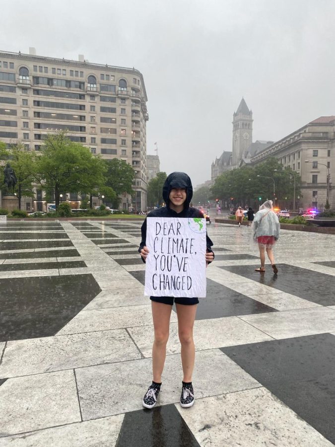 A+protester+holds+a+sign+with+the+words+%E2%80%9CDear+Climate%2C+Youve+Changed%E2%80%9D+at+the+End+the+Era+of+Fossil+Fuels+event+on+Saturday.