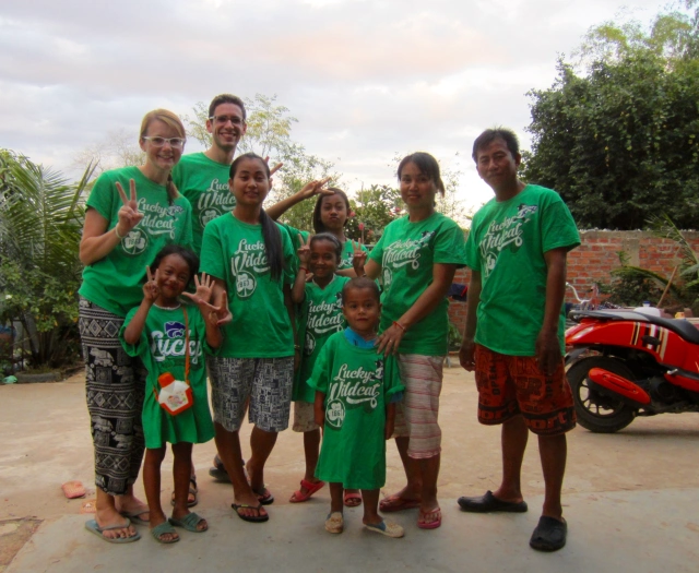 English teacher Matthew Bruneel and his wife Leshia with their host family during their time in the Peace Corps in Cambodia.